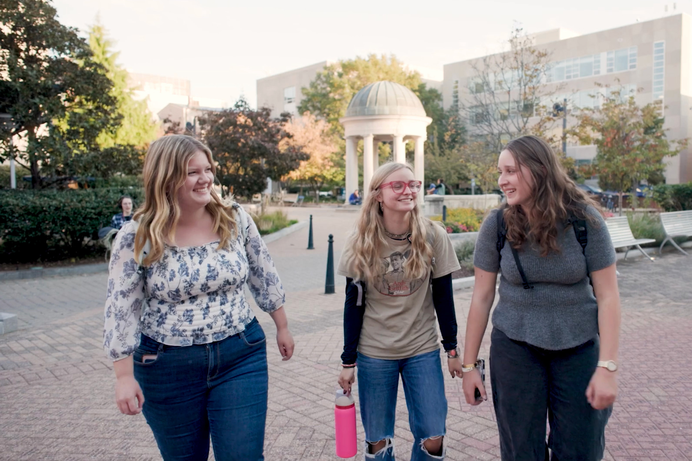 Riley walking across campus with classsmates