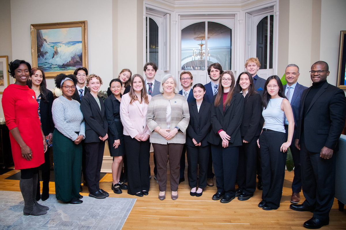 President Granberg poses with Clark Scholars, GW faculty and representatives from the Clark Foundation at the F Street House in November. (Abby Greenawalt/GW Today). 