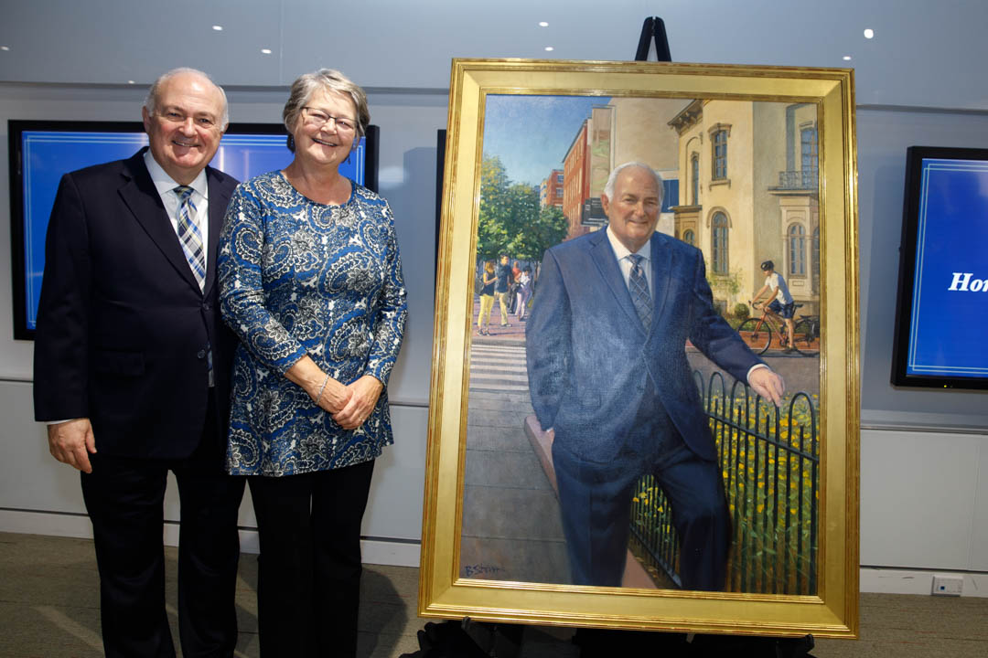 image of Steven Knapp and Diane Robinson Knapp with portrait. 