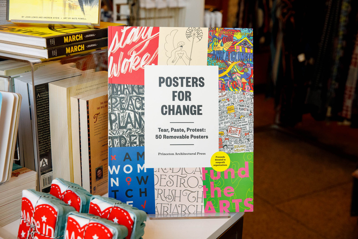 posters for change book on shelf