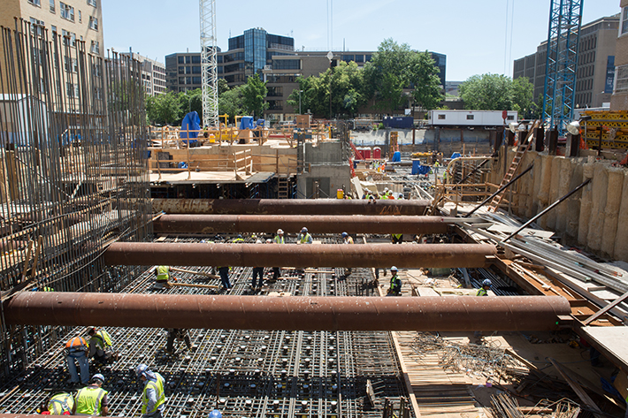 Rebar, large pipes, and other early construction work is laid for the future Science & Engineering Hall building.