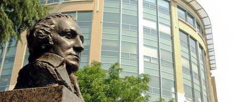 George Washington bust with the George Washington University Hospital in the background