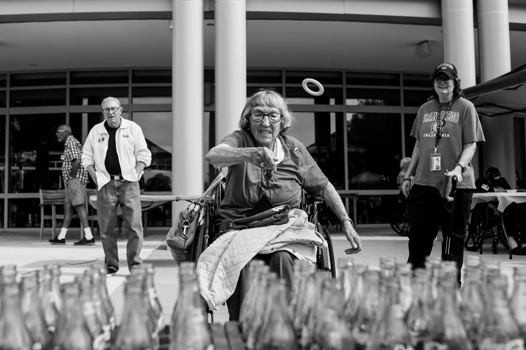 Catharine Deitch, 97, throws a ring toss during a funfair