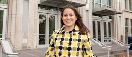 Andrea Ruiz stands in front of building 