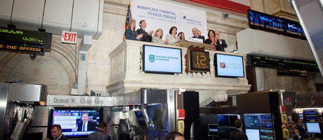 Annamaria Lusardi rings the bell at the New York Stock Exchange.