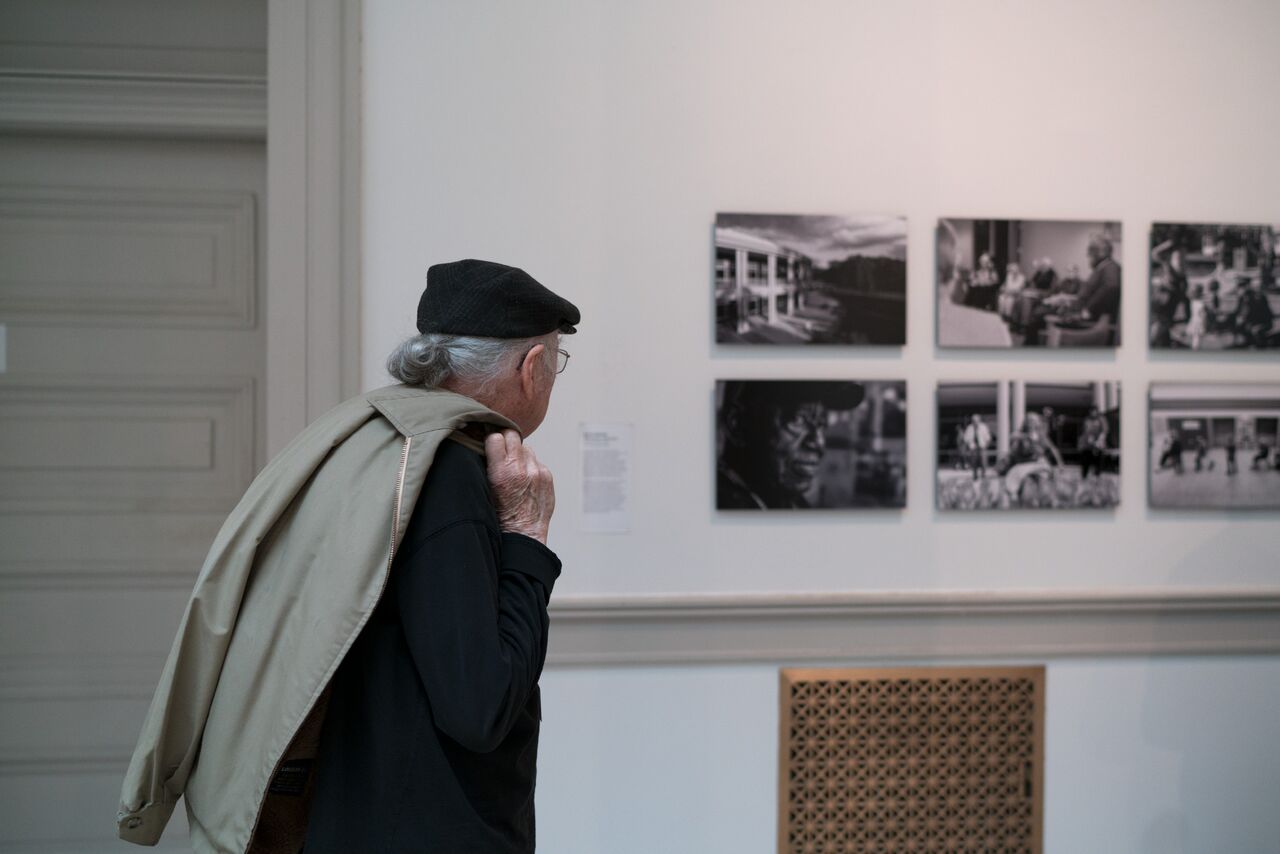 An AFRH resident examines Mr. Dietrich's work