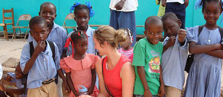 Ashley Chandler with a group of Haitian students