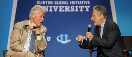 Jon Stewart and Bill Clinton at the Clinton Global Initiative University speaking on stage