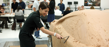Sona Iliffe-Moon smoothing clay on a clay model car