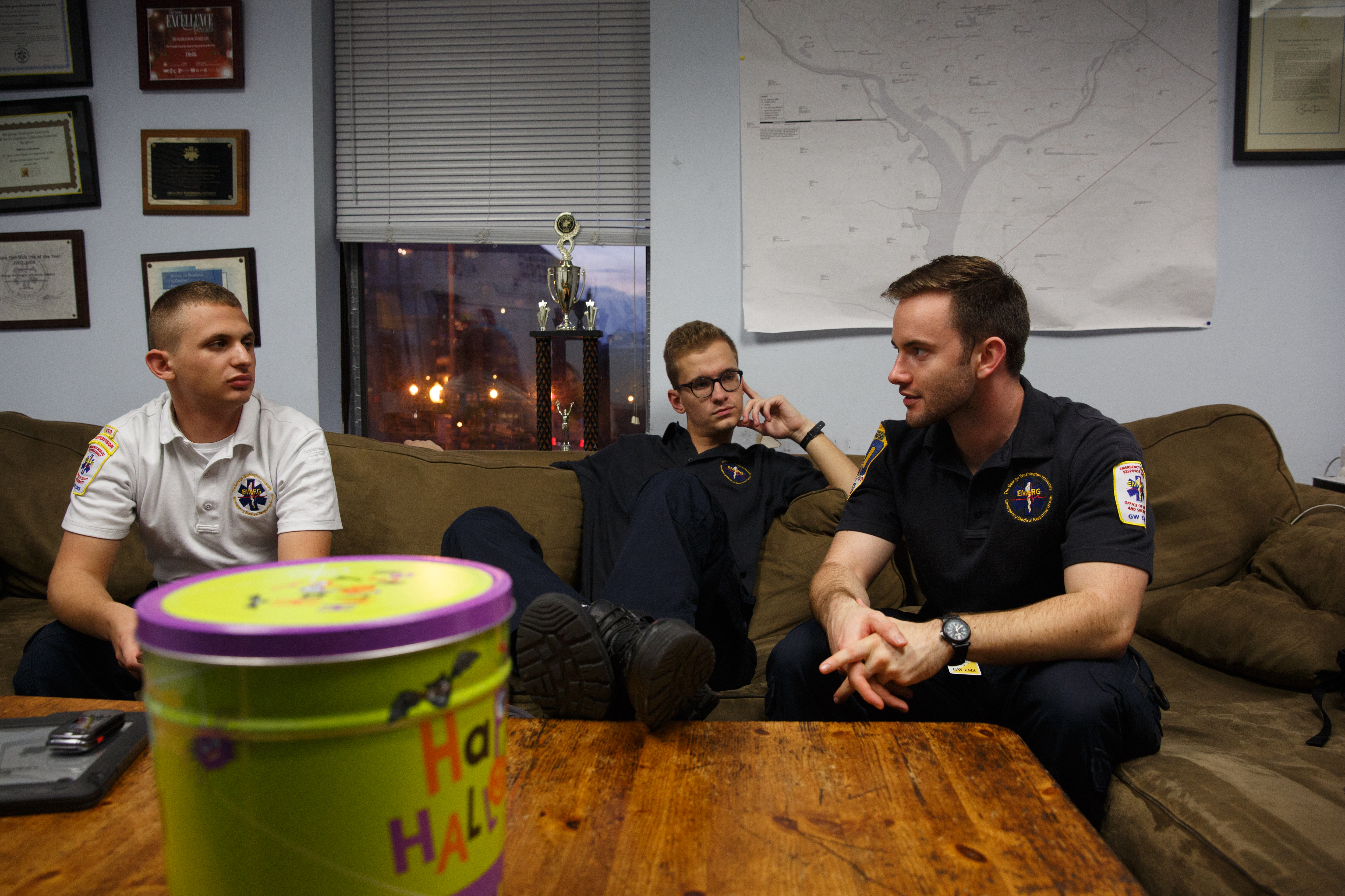 Jeff Schecter (left), junior Michael Magierski and senior Braden Adams relax while waiting for calls during an evening shift.