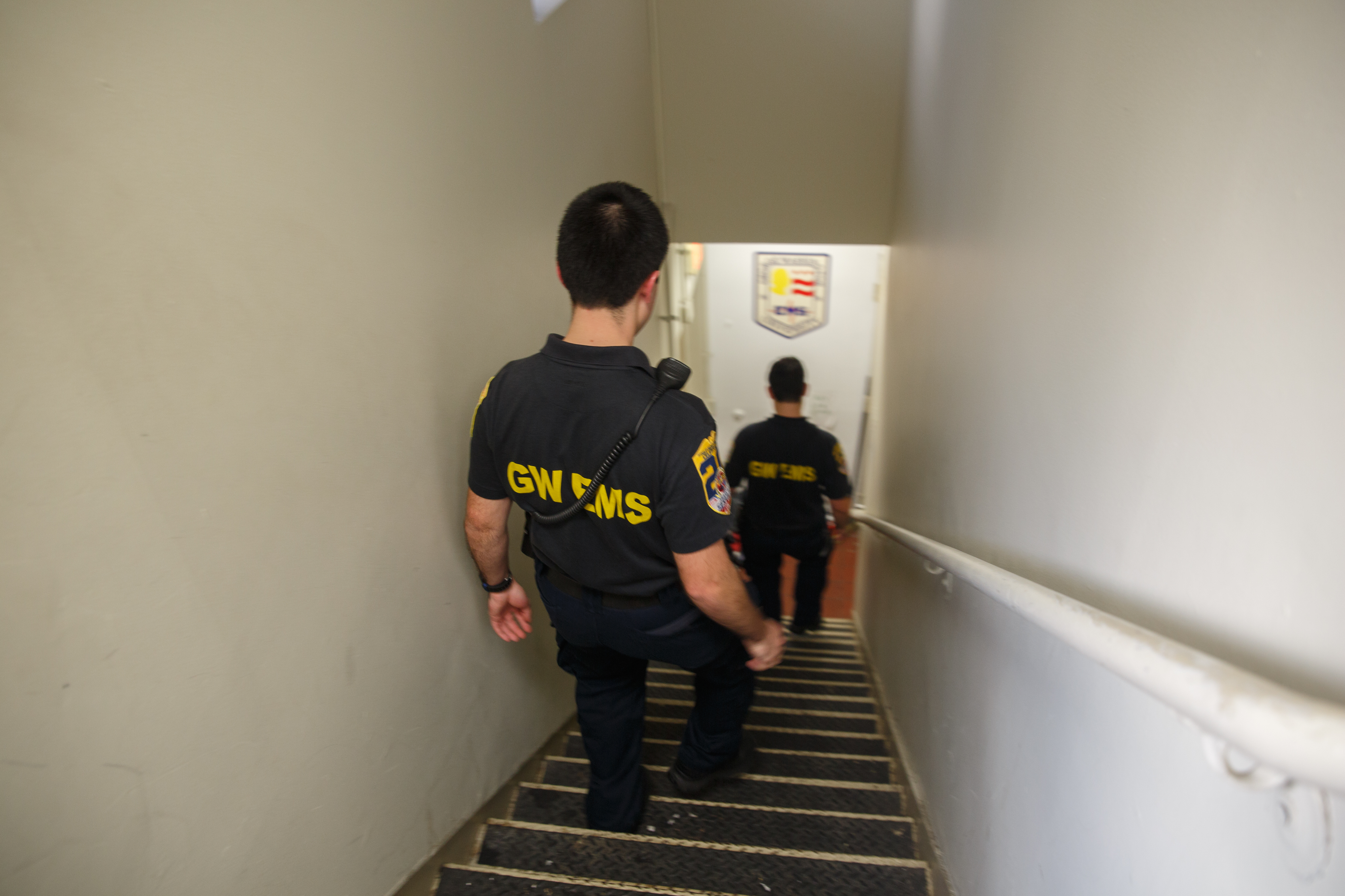 Chris Vakkur and sophomore Nate Hammond walk down the stairs from the second floor EMeRG office 