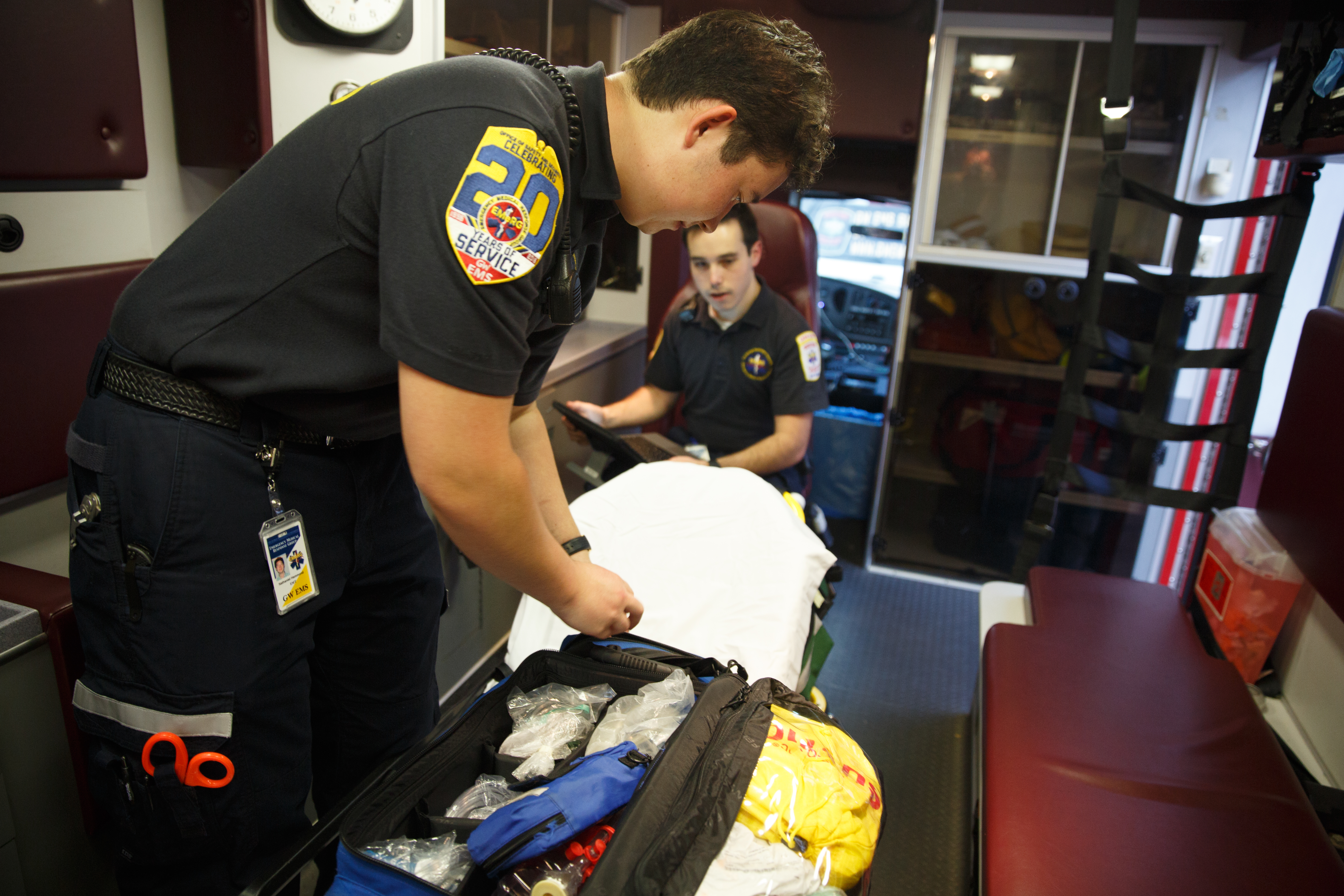 students scan interior of ambulance to check supplies