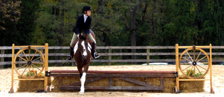 student on horse competes in equestrian event
