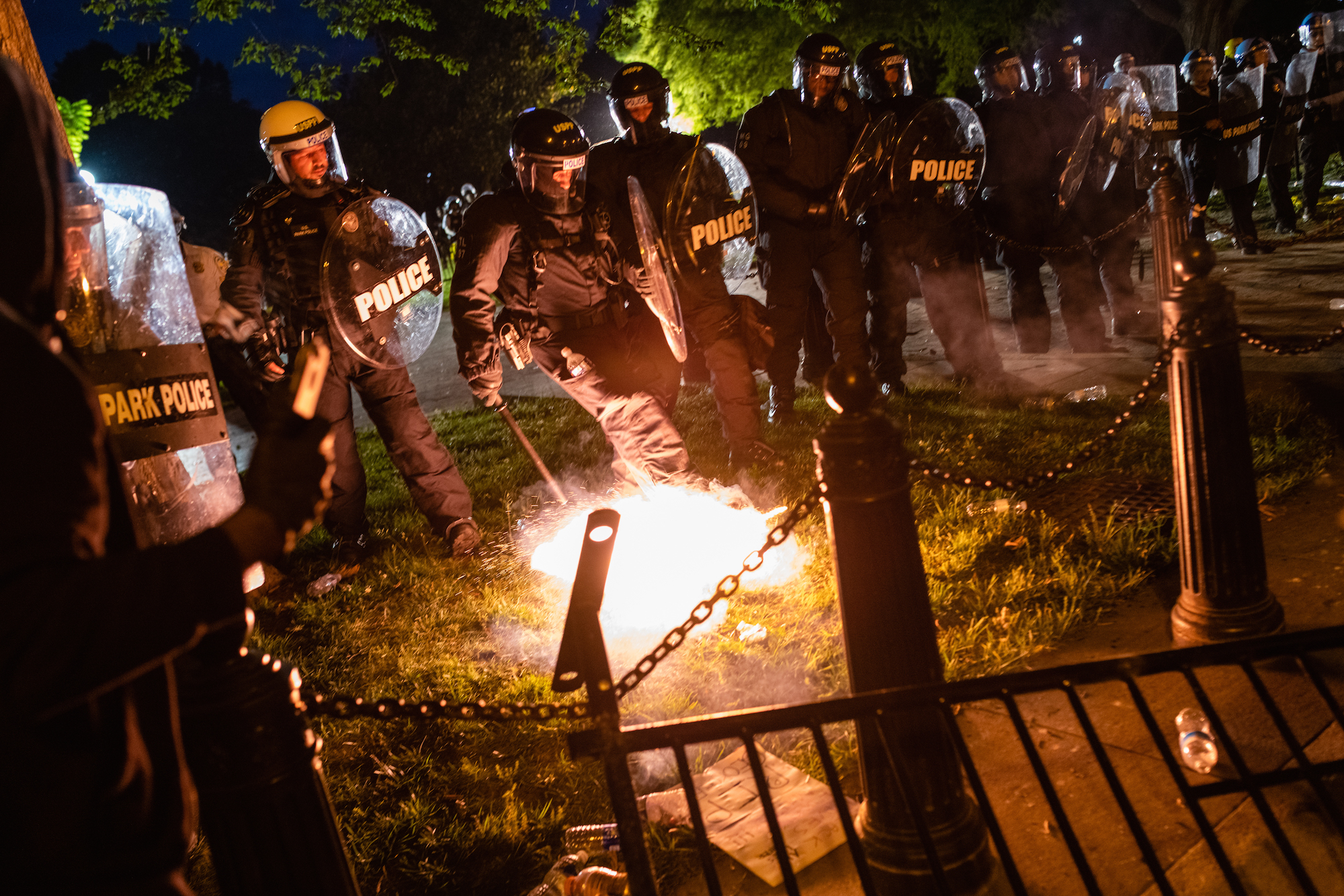 Image of police with a firework-like object