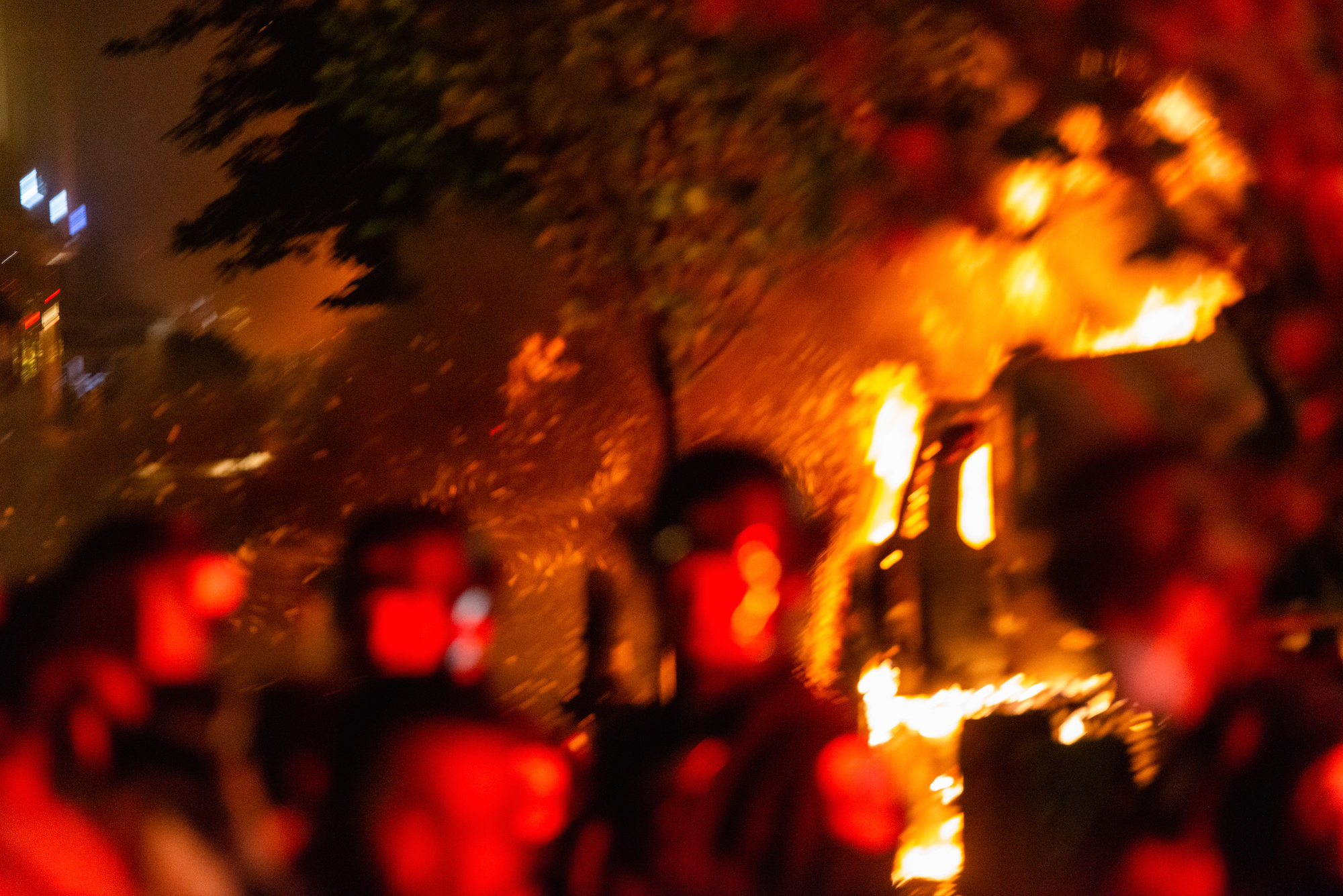 Image of helmeted figures among flames