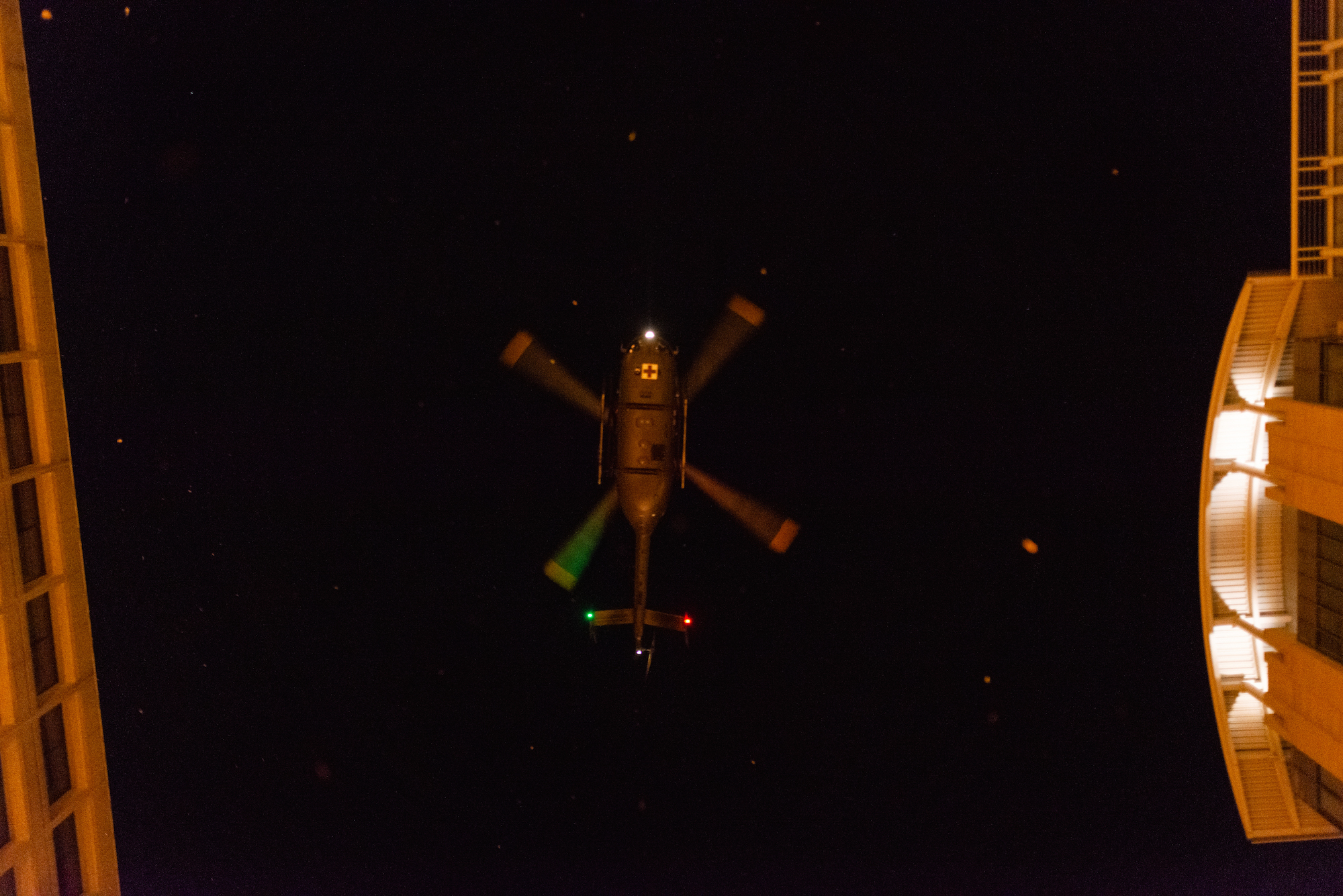 Image of a descending helicopter from beneath