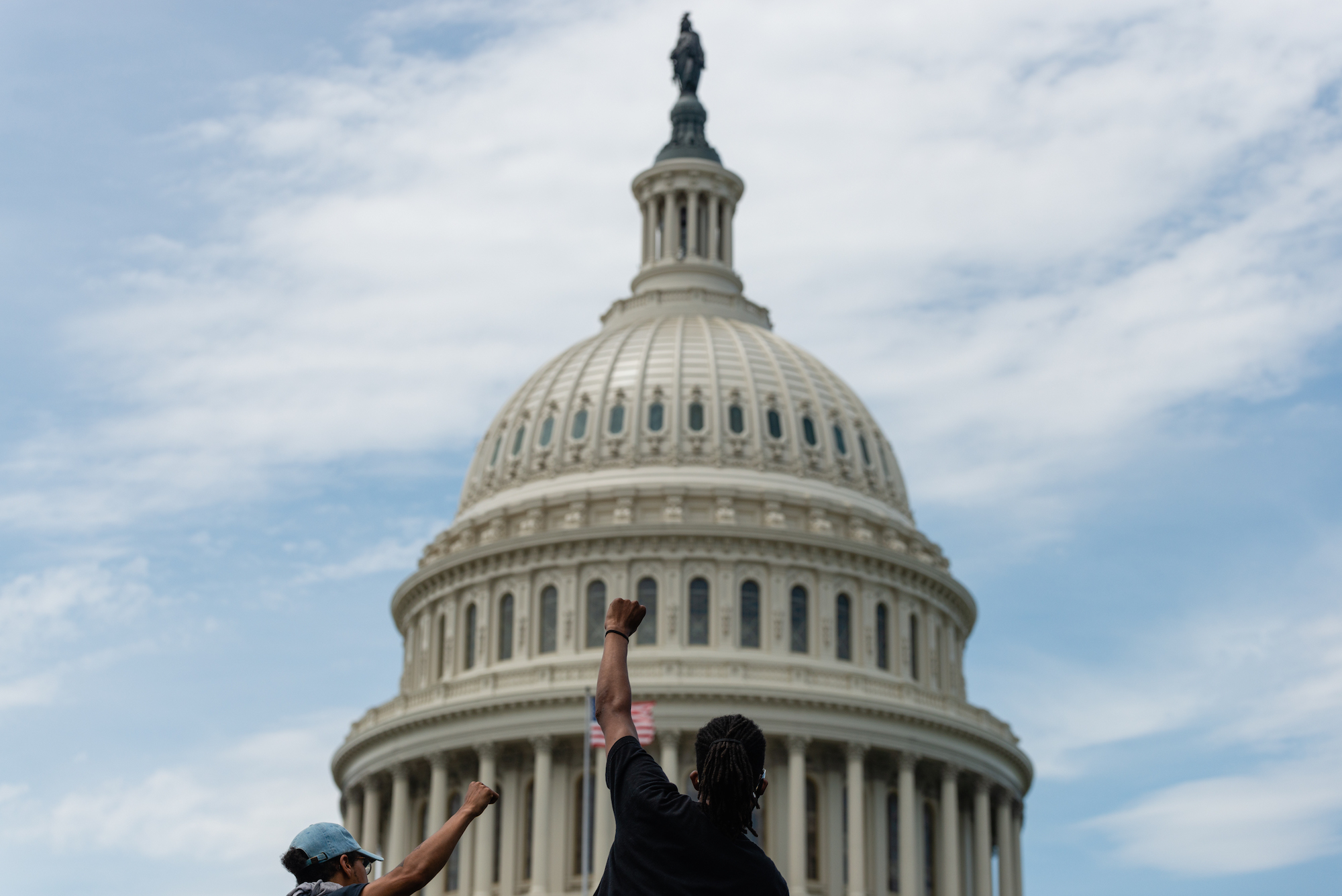 A protestor in front of the U.S. Capitol. (Eric Lee)