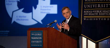 Michael R. Taylor speaks at a podium and speaks to audience