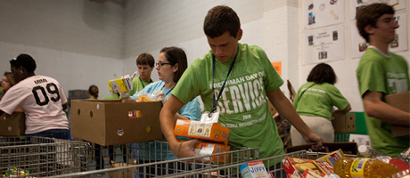 students volunteering in food bank on freshman day of service