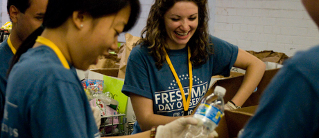 students volunteering during Freshman Day of Service packing bottled water into boxes