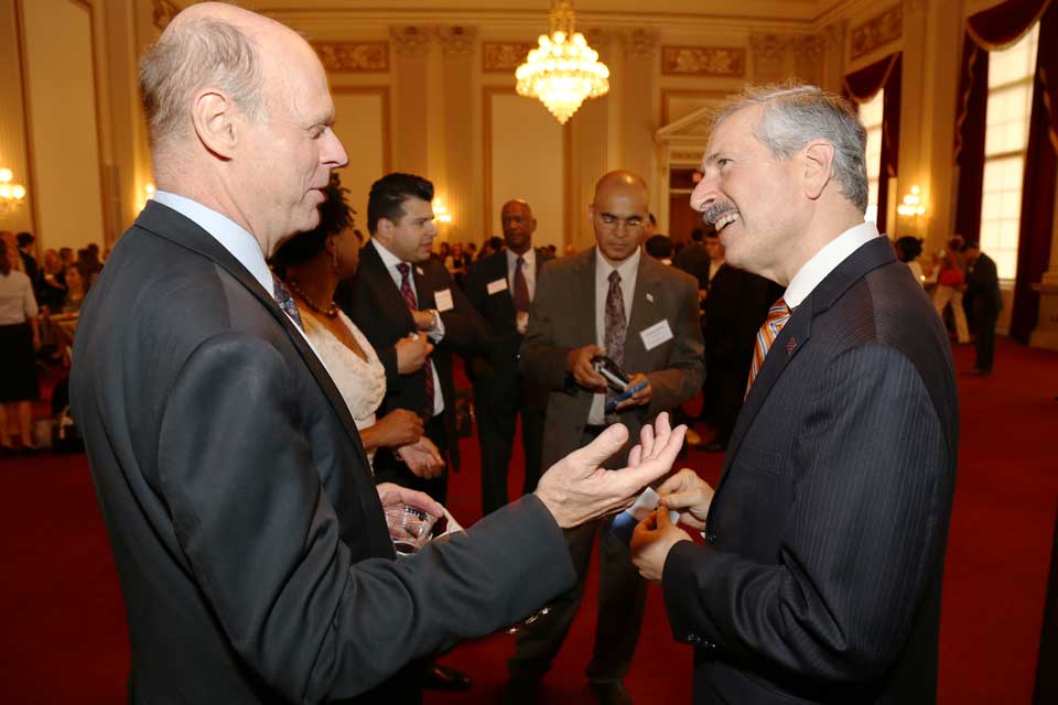 John Holmblad, M.S. ’80, shares a moment with Provost and Executive Vice President for Academic Affairs Steven Lerman.