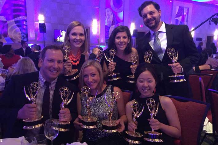 Marketing and Creative Services staff celebrates two regional Emmy wins.