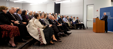 seated audience listening to Edward W. “Skip” Gnehm Jr. speak at podium