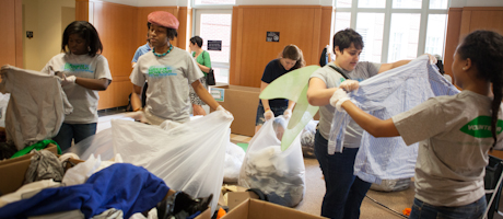 students working to organize green move out donations