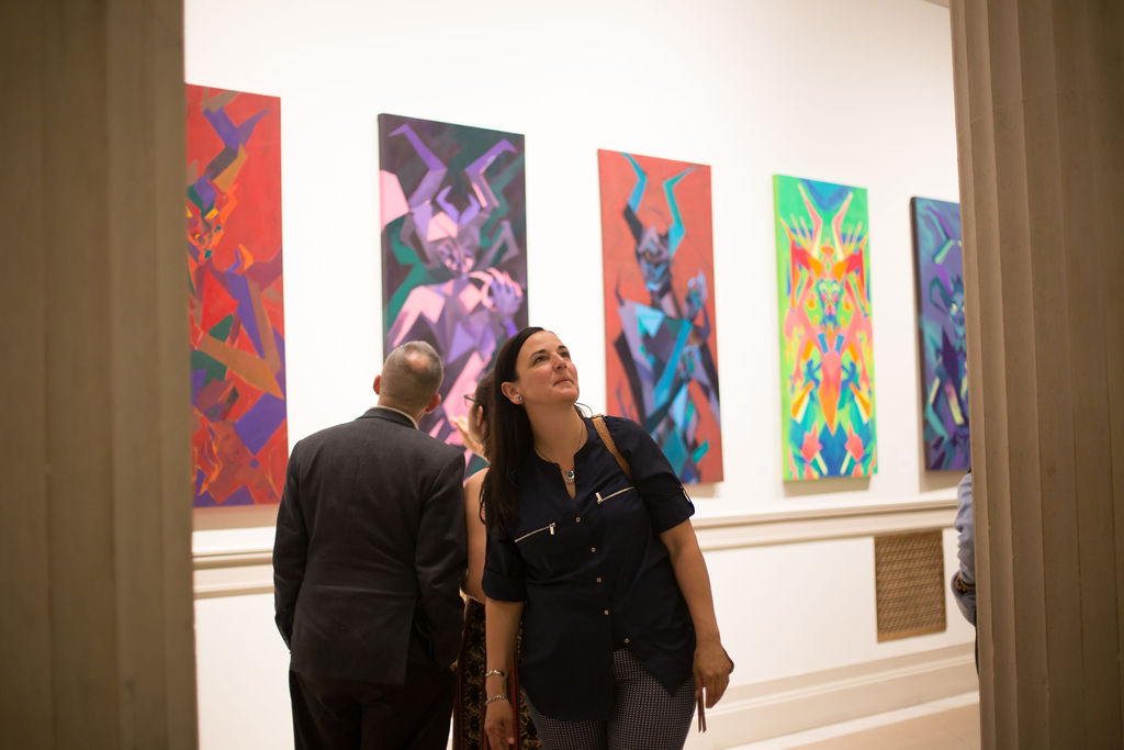 viewers of NEXT 2019 walk through gallery