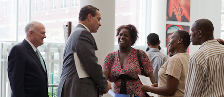 Steven Knapp and Vincent Gray speak with area residents at job fair 