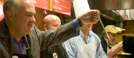 Steven Knapp and university administrators serving Midnight Breakfast