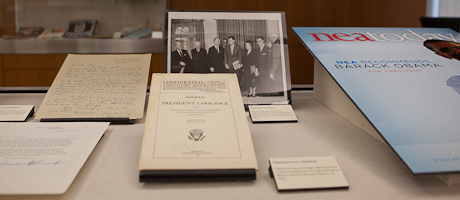 display case featuring National Education Association archives including letters, magazine cover