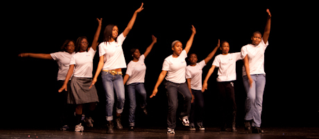 Students from Washington Middle School for Girls in Anacostia perform a traditional step show on stage