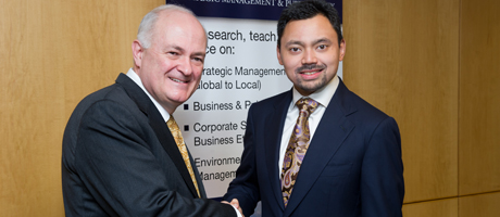 Steven Knapp shakes hands with His Royal Highness Prince Haji Al-Muhtadee Billah