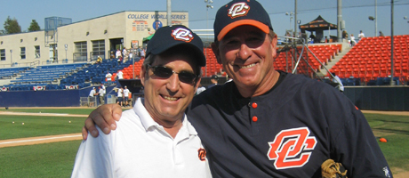 Robert Young and coach in baseball uniform smiling arm-in-arm on field