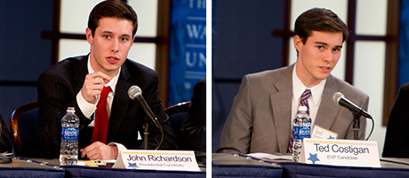 John Richardson and Ted Kostigan sit at tables talking with name tags in front of them