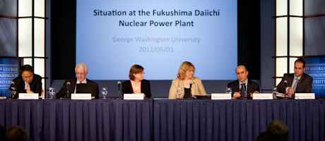 Situation at the Fukushima Daiichi nuclear power plant: panel of speakers sits at long table with screen behind them
