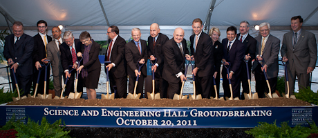 groundbreaking of SEH with members of the university community holding shovels to commemorate the moment