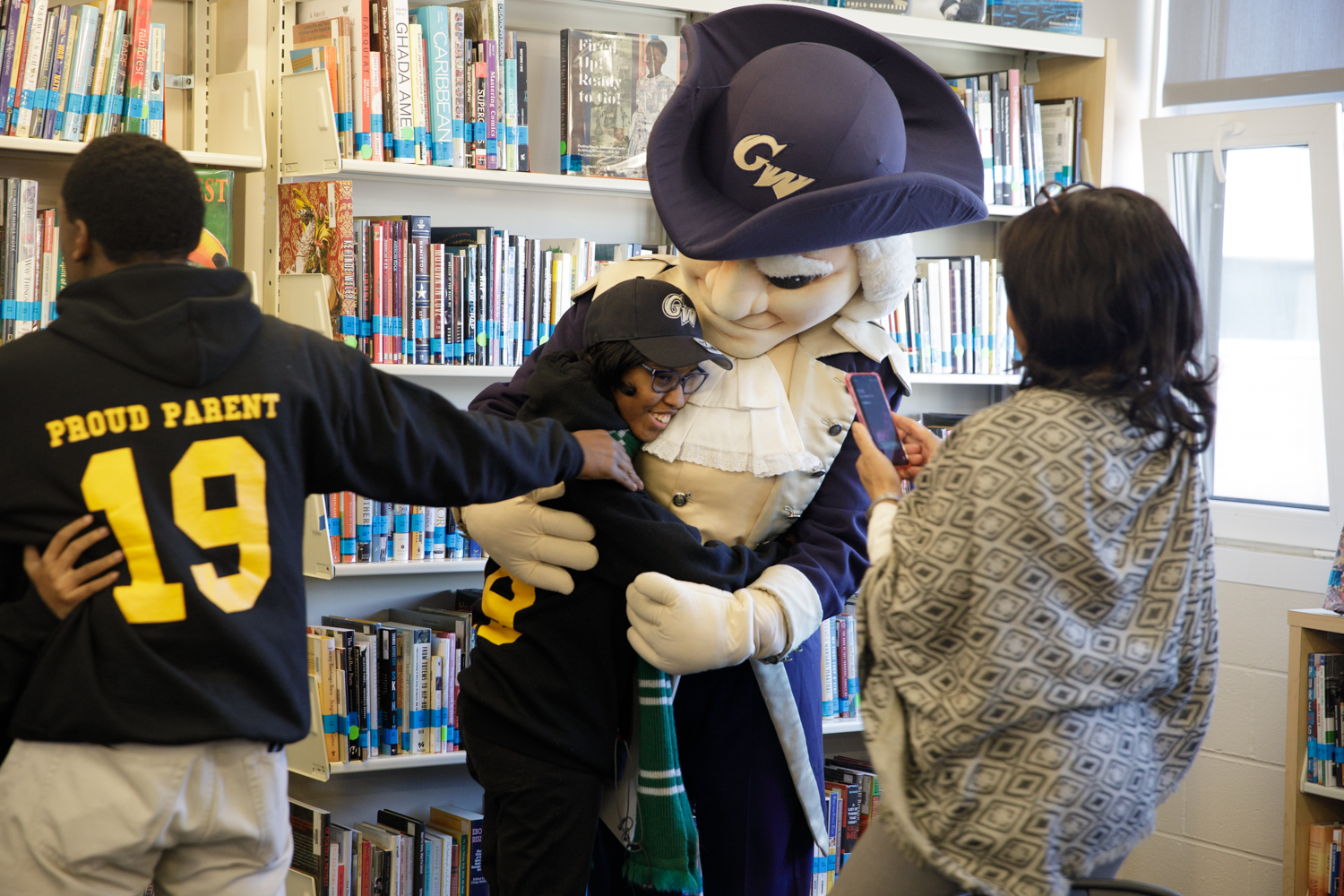 SJT recipient hugs mascot George 