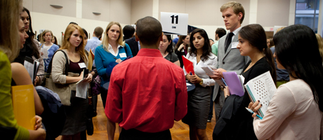 group of students standing talking and networking