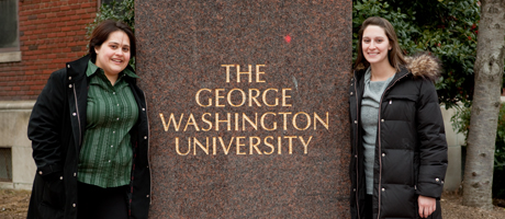 Sam McGovern and Casey Pierzchala stand by George Washington University landmark on campus