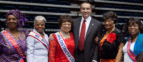 DC mayor stands with group of females attending GW senior prom