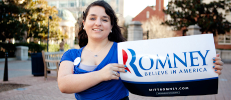 Shoshana Weissmann holds up a poster: "Romney, Believe in America"