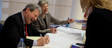 Steven and Cokie Roberts signing books at table at event