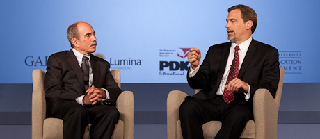 Bob Wise and Tom Vander Ark sit on chairs on stage, talking