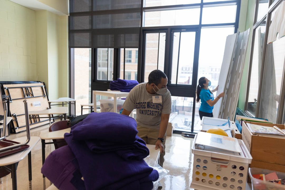 GW Students participate in Welcome Days of Service, helping to organize classrooms at the School Without Walls in Foggy Bottom.