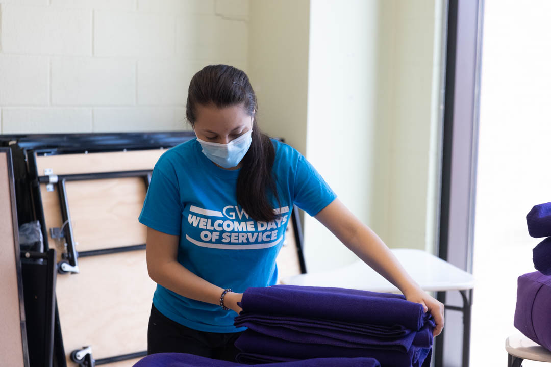 GW Students participate in Welcome Days of Service, helping to organize classrooms at the School Without Walls in Foggy Bottom.