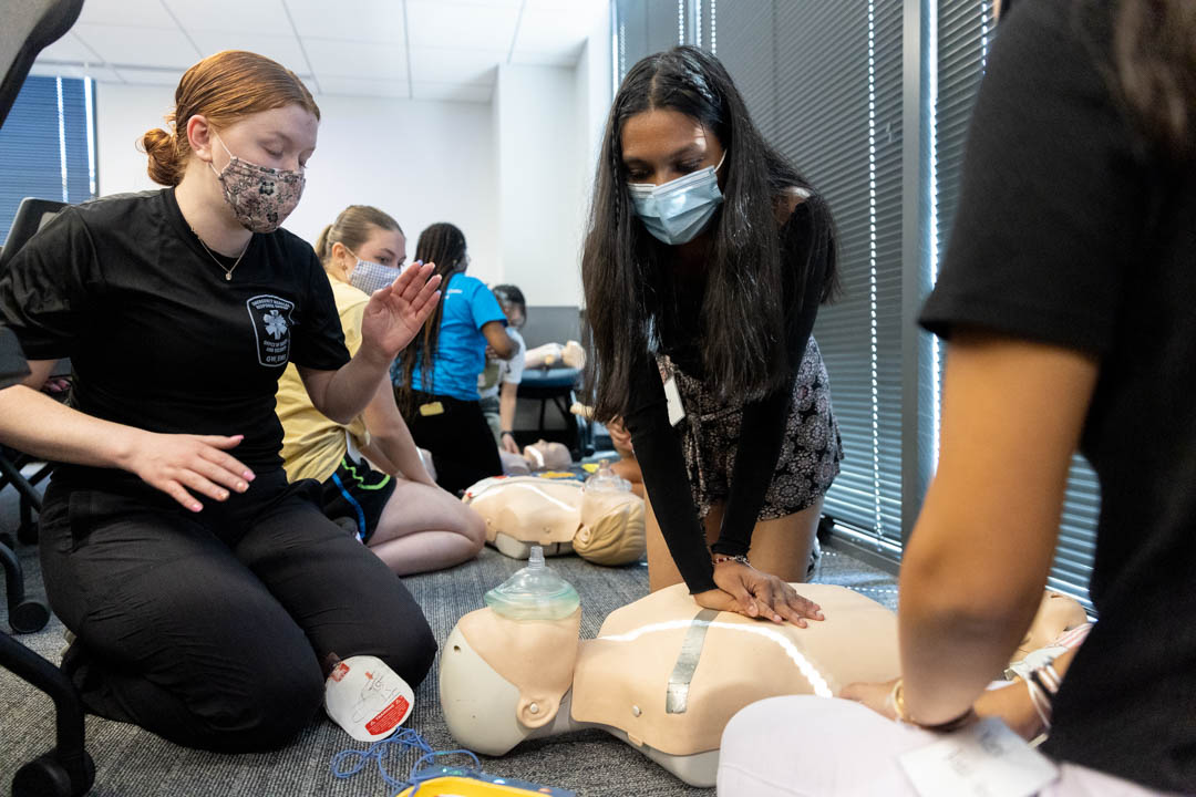 Students practice life-saving techniques during CPR training held during GW Days of Service.