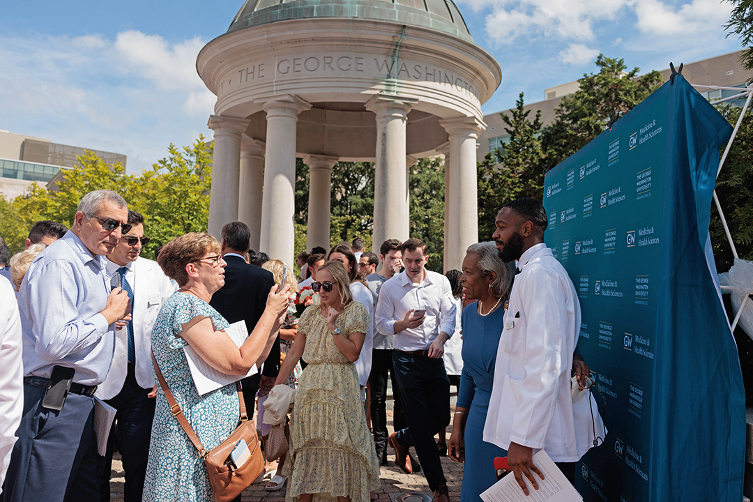 families taking photos after ceremony