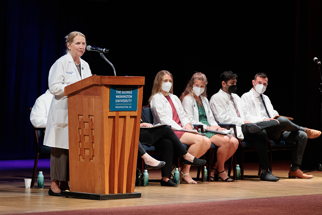 Dean Barbara Bass speaking at the podium